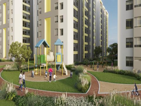 Fachada conjunto Monguí Colsubsidio muestra edificios, blanco y gris, y familia en la zona infantil.