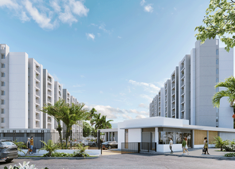 El proyecto vivienda Samán de Colsubsidio destaca por sus torres blancas, palmeras y zonas verdes.