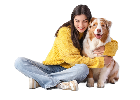 Mujer abraza a su perro sentados en el suelo