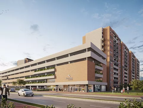 La fachada del conjunto Arbórea muestra edificios, vías, zonas verdes y personas.
