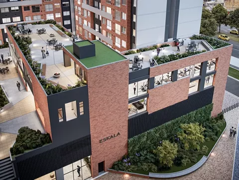 Visión aérea del conjunto Eskala muestra edificios, zonas verdes y terraza.