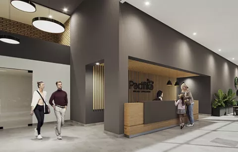 El lobby de Pacifika muestra personas caminando y una portería.
