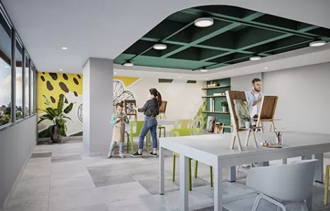 La zona creativa del conjunto Eskala muestra una mujer pintando un cuadro.