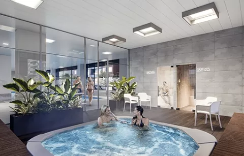 Spa de Mistral muestra personas conversando en jacuzzi y plantas.