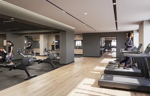 Zona fitness de Element 142 muestra personas entrenando en el gym.