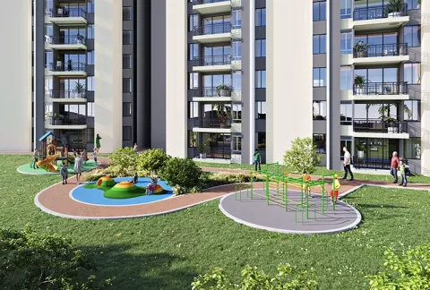 Parque de Entremontes muestra edificios, zonas verdes y personas caminado.