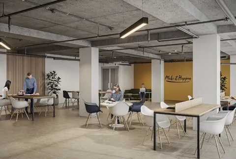 Coworking de Terralto muestra personas trabajando en sus portátiles y conversando