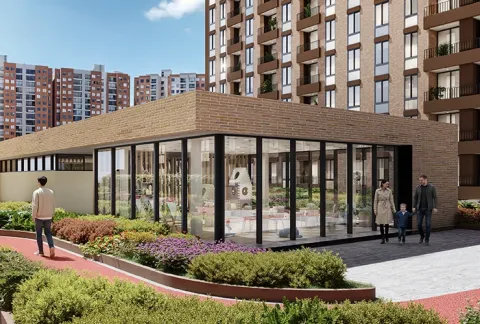 Exterior comunal de Nuva Park muestra edificios, zonas verdes y personas caminando
