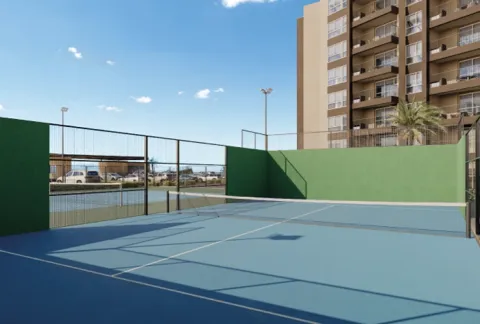 Cancha deportiva Llano Kristal, muestra una cancha con las torres del proyecto al fondo.