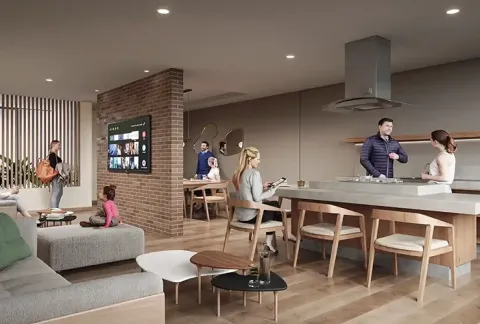 Sala premium de Floresta Living muestra personas conversando y niños viendo TV