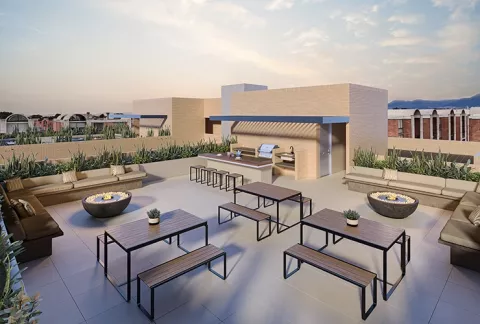 Terraza 360 Abeto, muestra la terraza con zona de BBQ, mesas y sofás.