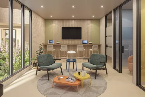 Social Spot Abeto, muestra la sala social con cocina, comedor y televisor.