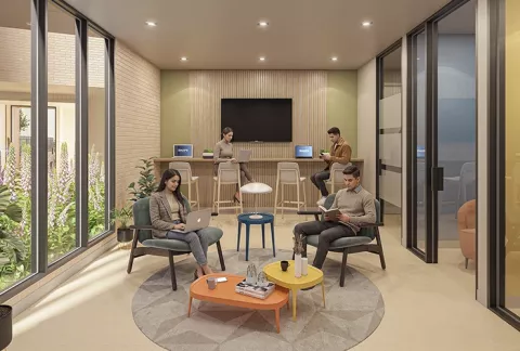 Work and Chill Abeto, muestra personas trabajando en la zona de coworking.