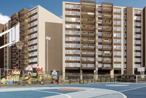 Zona infantil y cancha múltiple Llano Kristal, muestra juegos y una cancha junto a las torres.